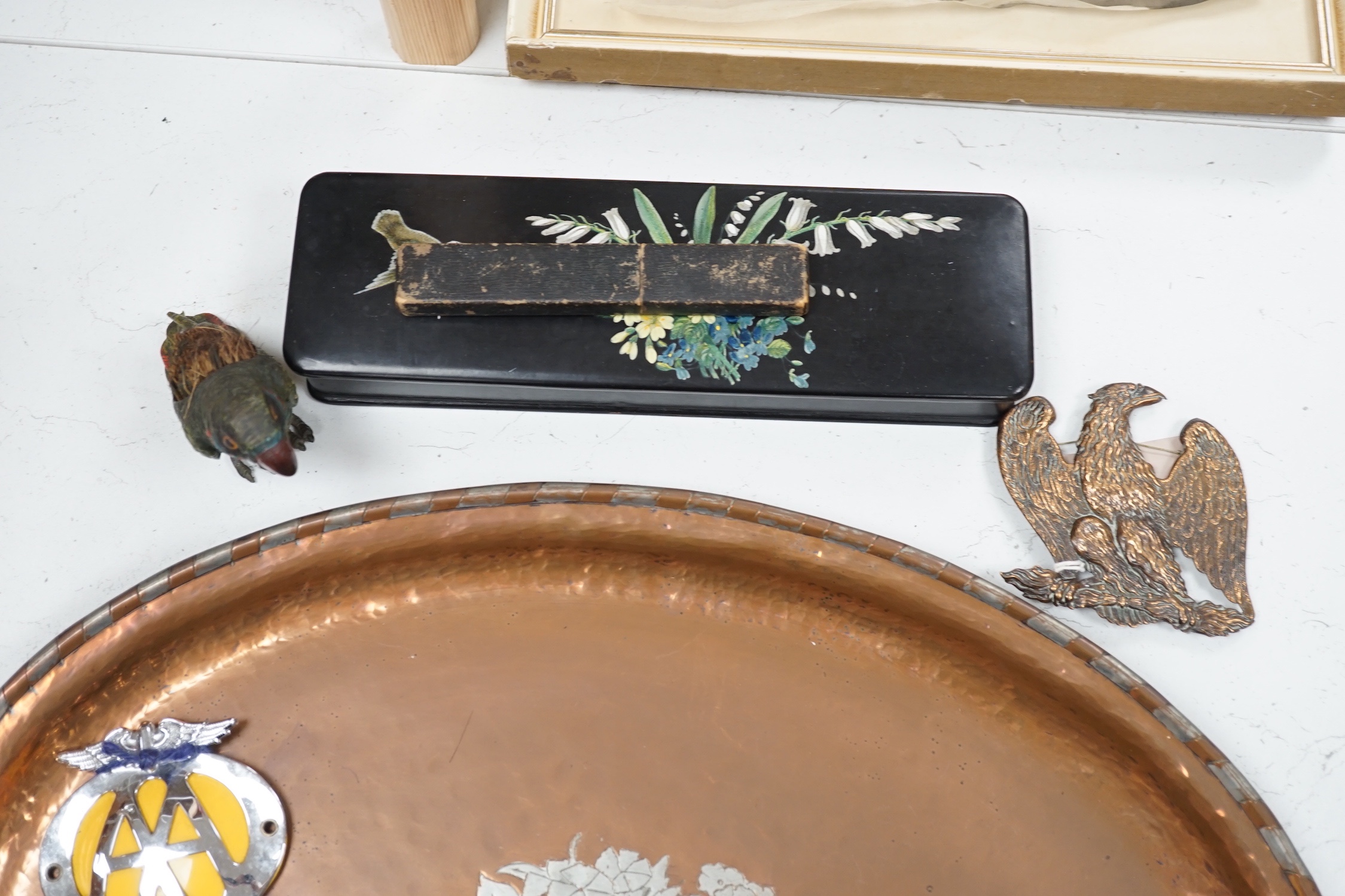 A large oval copper tray, cold-painted spelter parrot and four other items